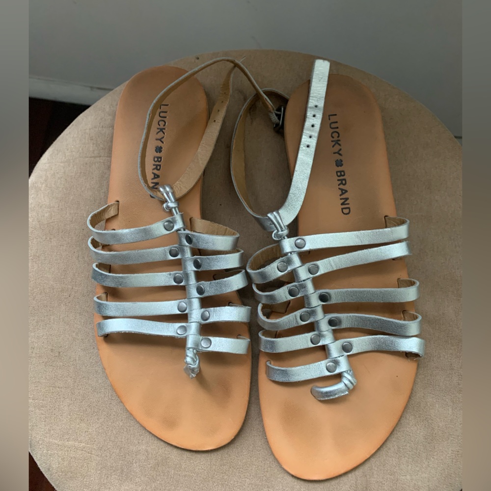 Lucky brand silver flat gladiator size 6, never worn